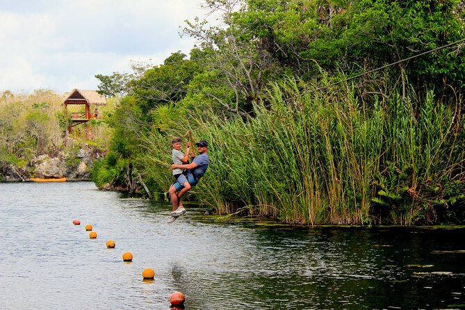 4 Private Cenotes, Zip-Lines, Canoes & Mayan Village with Delicious Lunch - Zip-lines, cliff jumps, and canoes at Tankah Beach