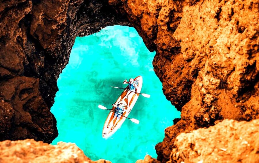 Albufeira: Hidden Beaches & Cliffs Guided Kayak Cave Tour - Paddling past Praia da Coelha