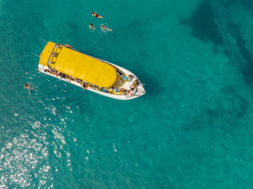 Alcudia: Coll Baix Beach & Sea Caves Cruise with Snorkeling - Sailing out across Alcudia Bay