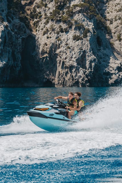 Alcudia: JetSki Tour Coll Baix beach & Caves (free Photos) - Alcanada lighthouse island and the first photo stop