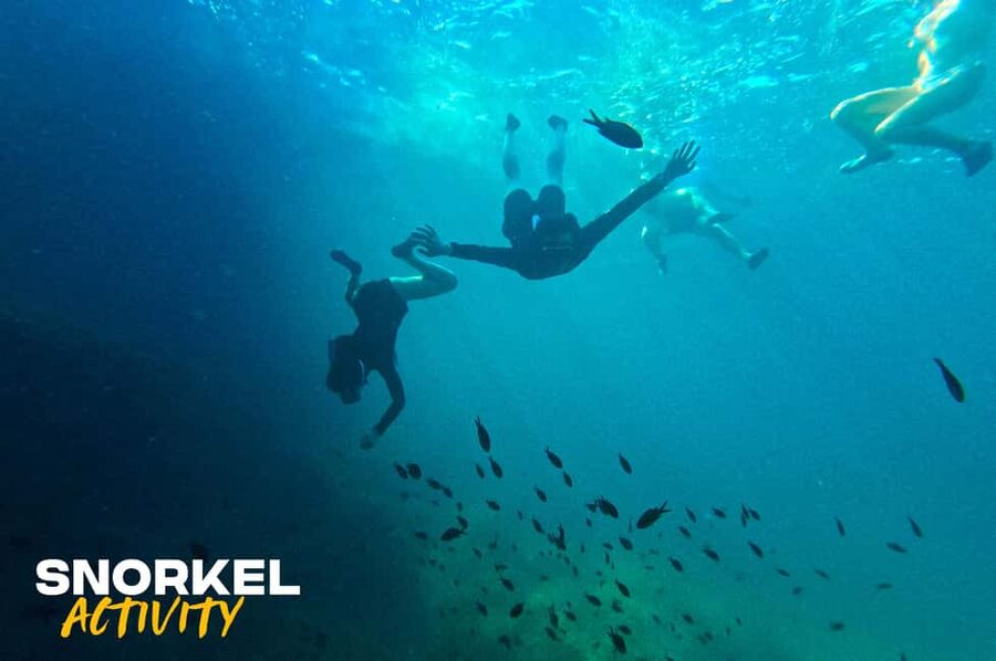 Alcudia: Kayak Tour with Snorkel & Sea Cave Swim - Entering the sea caves