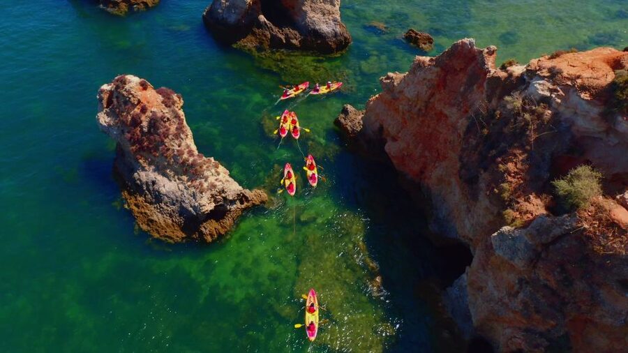 Alvor: Explore Caves Boat and Kayak Tour - Swimming from the boat at the secret stop