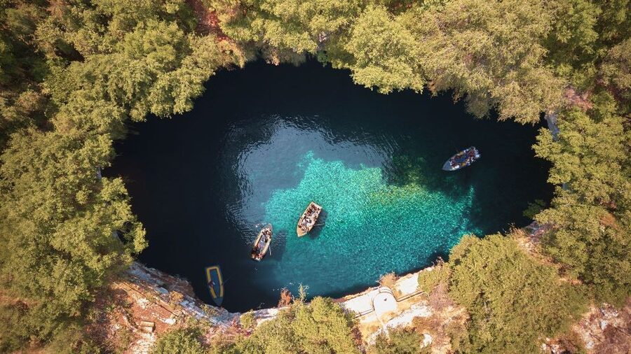Argostoli: Melissani & Drogarati Cave Tour with Wine Tasting - Melissani Cave by traditional wooden boat