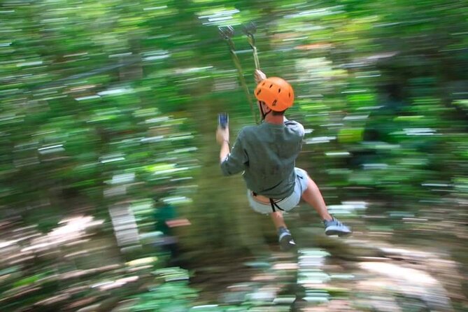 ATV Cenote and Zipline Sacred Jungle Expedition - Ziplining above the trees