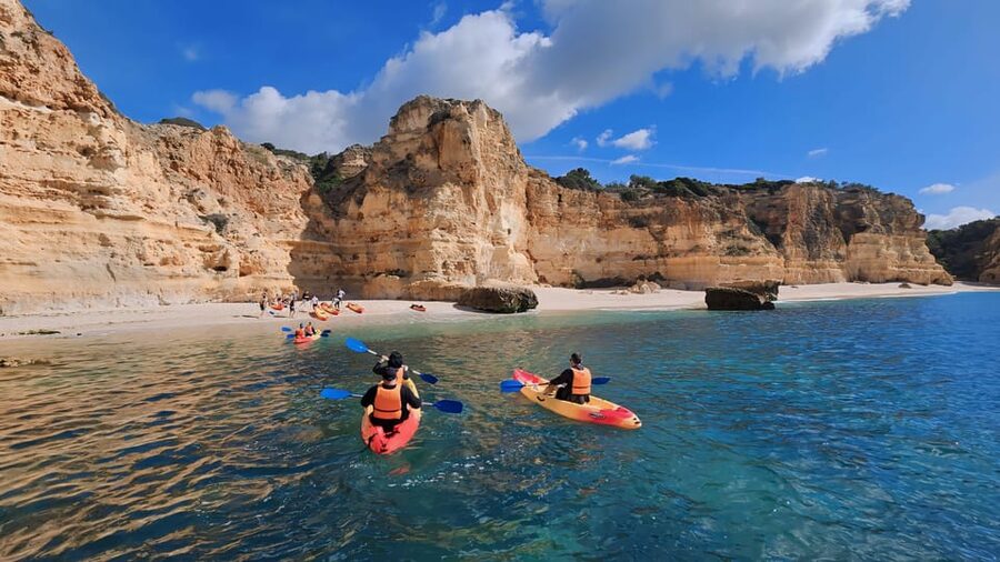 Benagil: Sunrise kayak tour Benagil caves and secret spots - Praia da Marinha adds a second coastal view