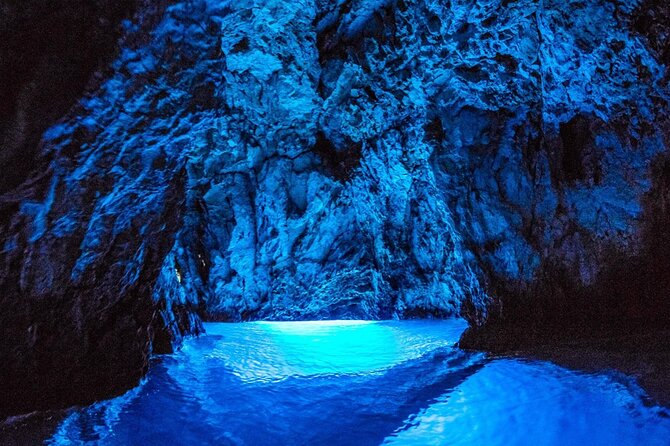 Blue cave group tour with swimming and snorkelling from Hvar - Stiniva Cove and its high cliffs