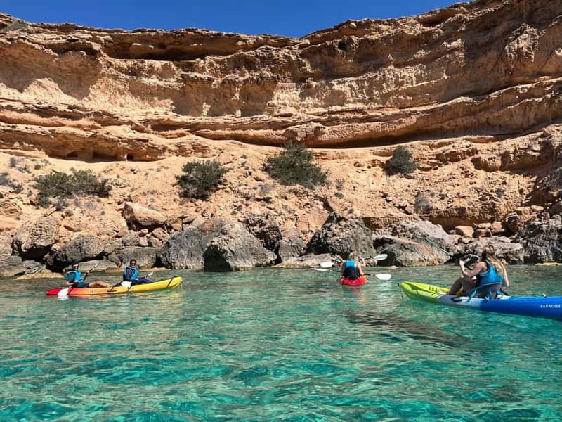 Cala Codolar: Sea & Caves Kayaking Tour with Snorkeling - Your first paddle into the clear water