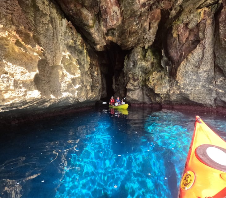 Cala en Porter: Menorca Caves Kayaking Tour & GoPro Photos - Paddling beneath Menorca’s cliffs