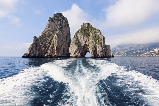 Capri & Blue Grotto Semi Private Boat Day Trip from Sorrento - Grottoes around Capri, seen from the water