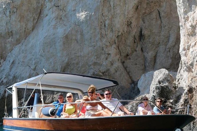 Capri Boat Tour from Sorrento: Swim, Grottos & Light Lunch - Capri’s grottos, cliffs, and Faraglioni rocks