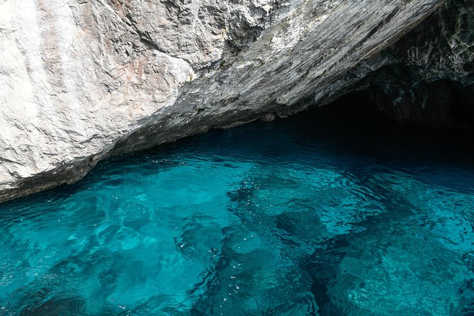 Capri Coast to Coast: Boat Tour with Optional Blue Grotto - The first caves: Marvellous, White, and Green