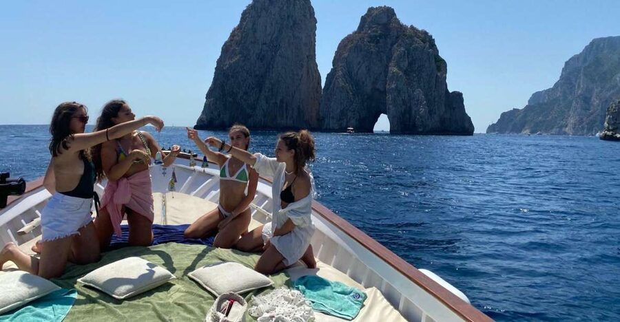 Capri: Island and Grottos Boat Cruise with Snacks and Drinks - Entering the White and Green Grottos