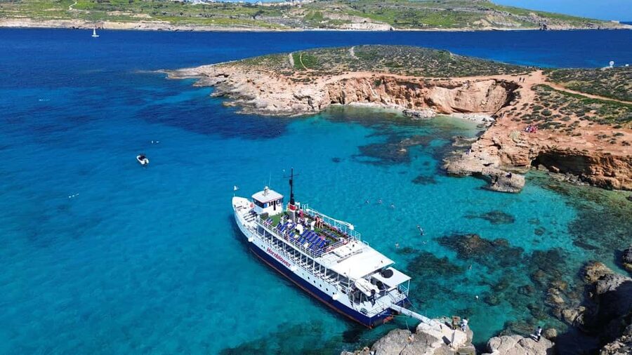 Comino: Blue Lagoon & Caves Boat Cruise - Crystal Lagoon and St. Mary’s Tower on the return