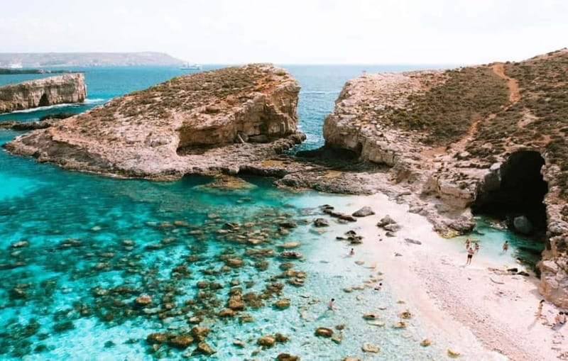 Comino & Gozo: Blue & Crystal Lagoons Cruise with Sea Caves - Leaving Ċirkewwa and passing Comino Tower
