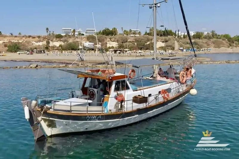 Faliraki: Boat Trip to Afandou Caves, Anthony Quinn & Ladiko - Leaving Faliraki Harbour beside the small church