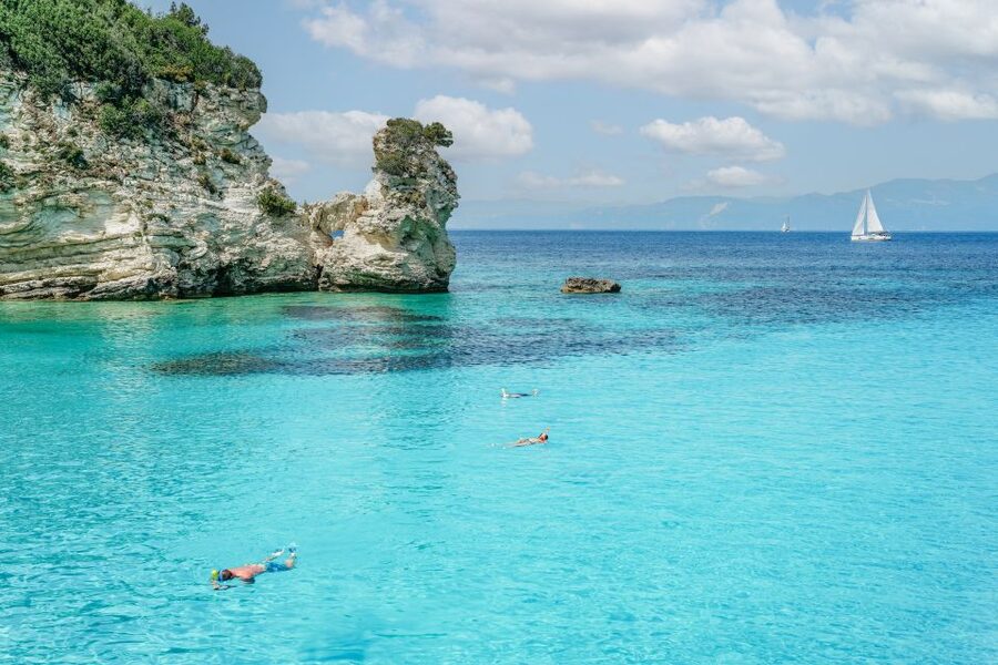From Corfu Island: Antipaxos & Paxos Blue Caves Boat Cruise - The return ride: music, dancing, and a long crossing