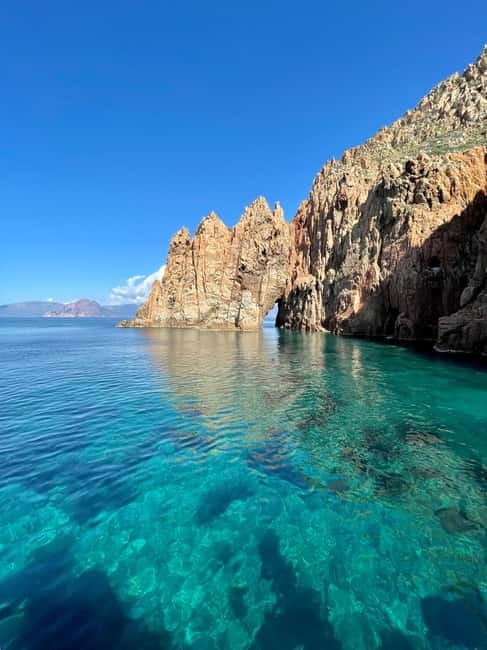 From Sagone/Cargèse: Piana Sea Caves & Snorkeling Boat Tour - The Genoese Tower of Omigna sets the scene