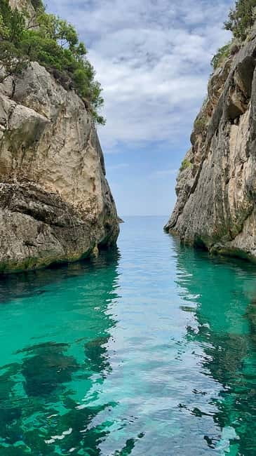 From Vlore: Blue Cave and Grama Bay Adventures - Englishman Bay and the Blue Cave at Llovizi