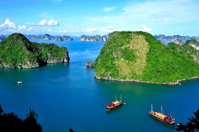 Halong Bay Day Tour With Titop Island, Cave, Kayak & Lunch - Cruising past Halong Bay’s limestone towers