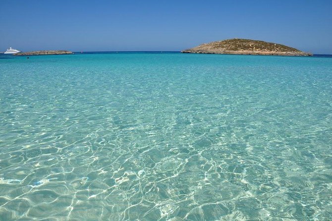 Ibiza Snorkeling Beach and Cave Tour - Drinks, music, and the boat atmosphere