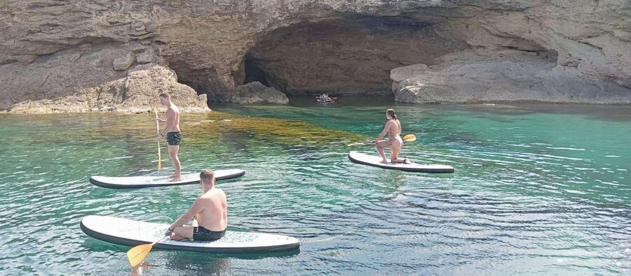 Ibiza: Snorkeling, Sunset Beach and Cave Boat Trip - Cala Comte: clear water and paddleboard time