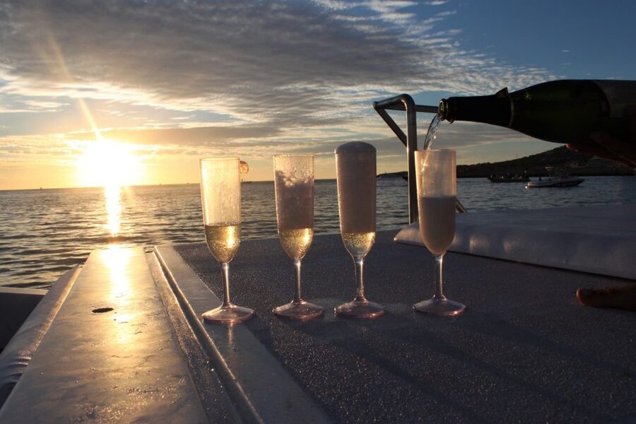 Ibiza: Snorkeling, Sunset Beach and Cave Boat Trip - Sunset from the boat with Cava