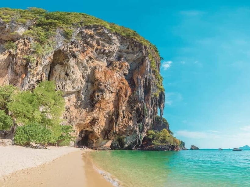 Krabi: Railay Phra Nang & Diamond Cave Sunset Plankton Tour - Phra Nang Beach, cave legends, and rock climbers