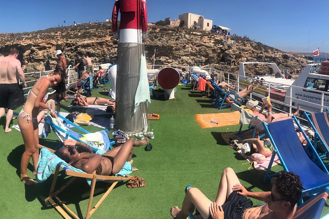 Malta: Comino, Blue Lagoon & Caves - swim, snorkel & slide - Cruising around Comino’s cliffs