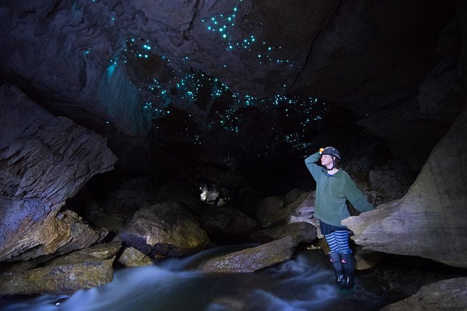 Private Waitomo Glowworm Cave Tours - Moving through narrow passages and knee-deep water
