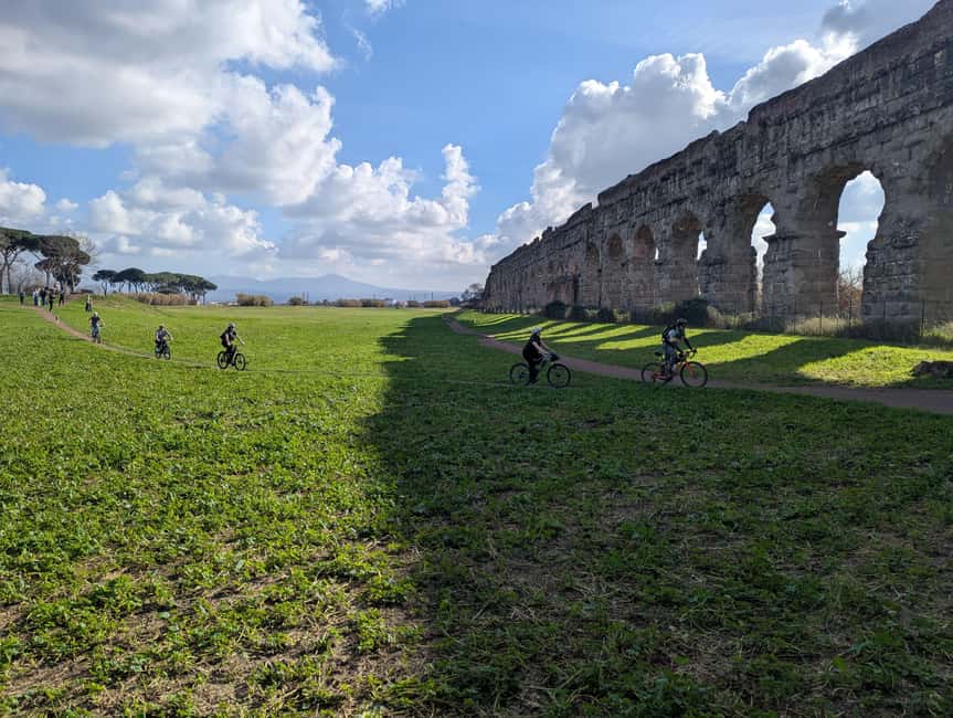 Rome: Appian Way, Catacombs & Aqueducts by eBike + Transfer - Riding the Appian Way past Rome’s tombs