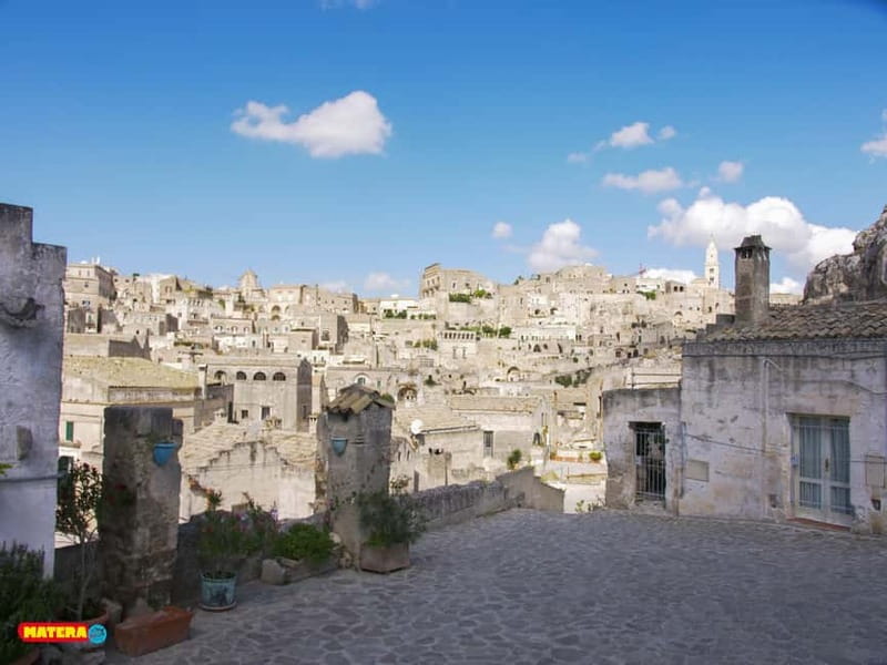 Sassi di Matera: Guided Walking Tour with Cave House/Church - Entering a frescoed rock church