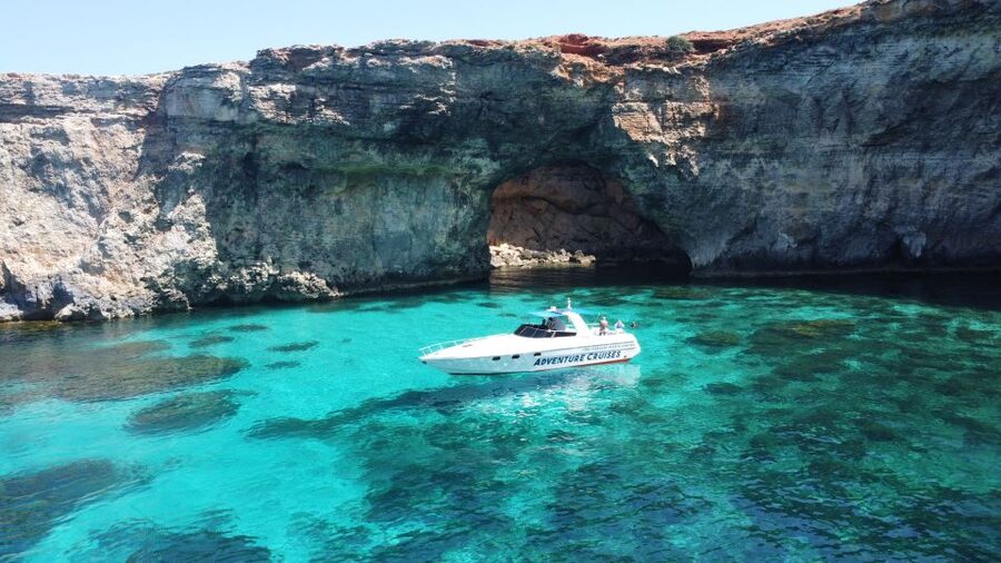 Sliema: Boat Trip to Comino Blue Lagoon, Gozo, and Caves - Leaving Sliema on a small powerboat