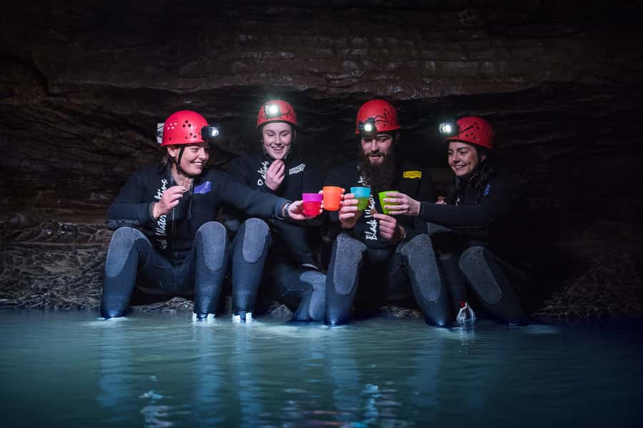 Waitomo Caves Black Abyss Ultimate Caving Experience - Timing, transport, and booking details