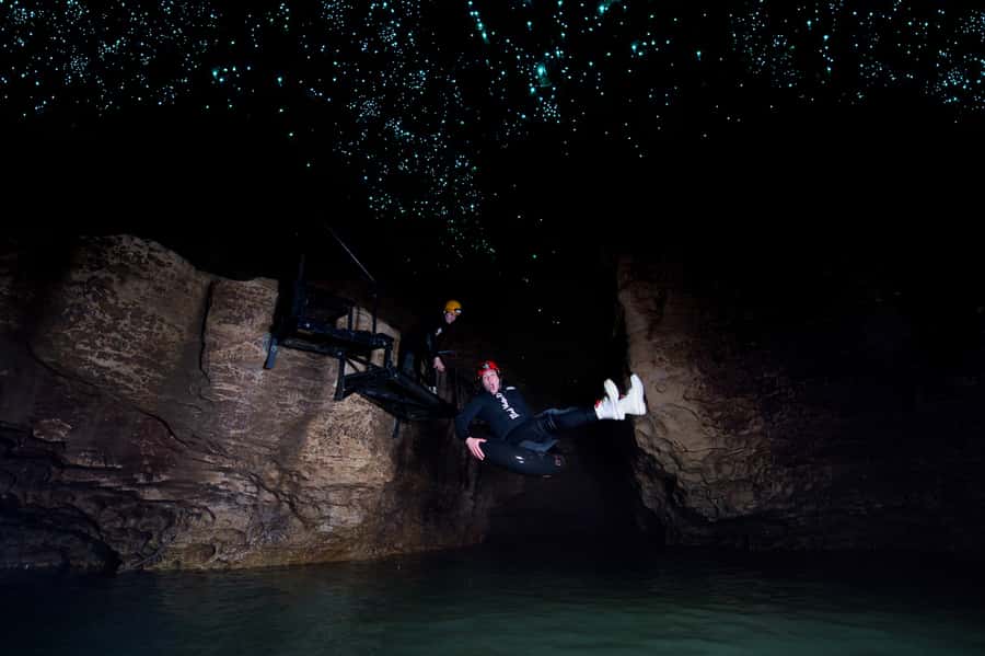 Waitomo Caves: Labyrinth Black Water Rafting Experience - Waterfalls, rock slides, and the first rush of adventure
