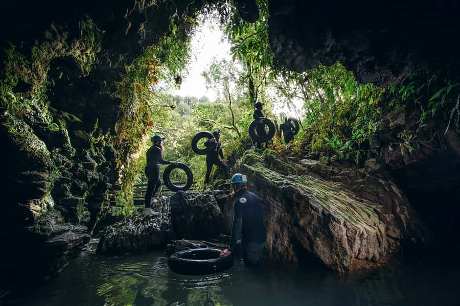Waitomo Caves: Labyrinth Black Water Rafting Experience - Getting suited up for 10 to 14 degree water